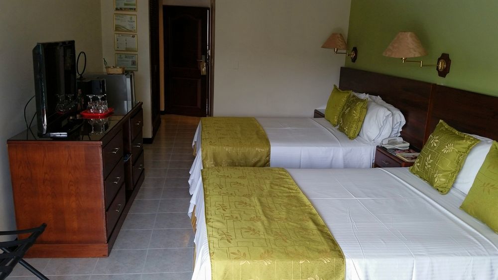 Casa Morales Hotel Internacional Y Centro De Convenciones Ibagué Dış mekan fotoğraf A room at the hotel
